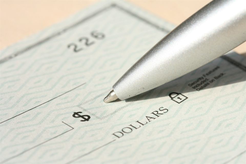 Pen writing a check
